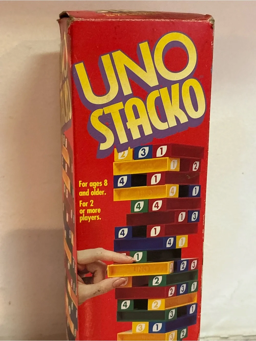 Mattel UNO Stacko Red Game Box with Yellow and Blue Elements